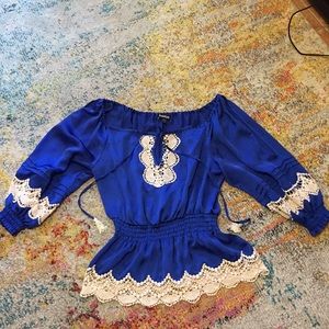 BEBE brand blue top with cream colored lace detail